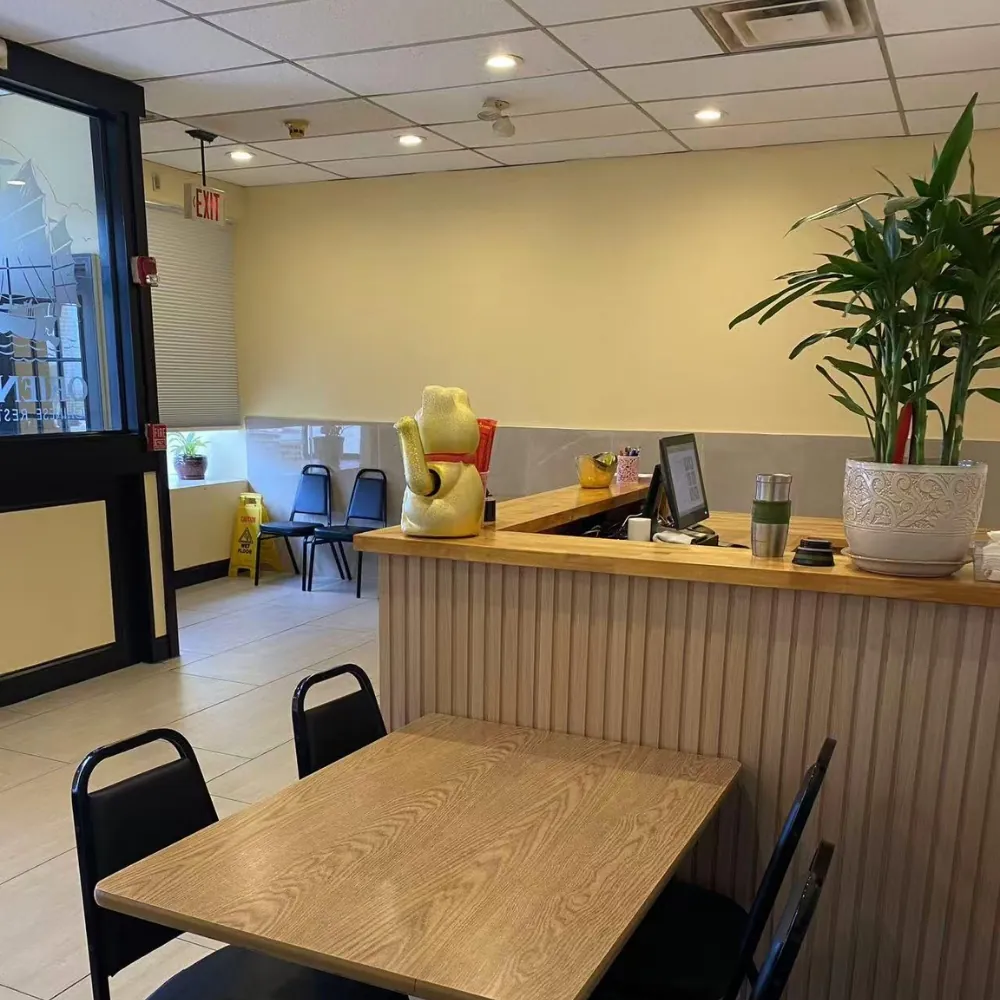 Counter, wall dishes and seating at Oriental Chinese Restaurant, a Chinese Restaurant in Woburn