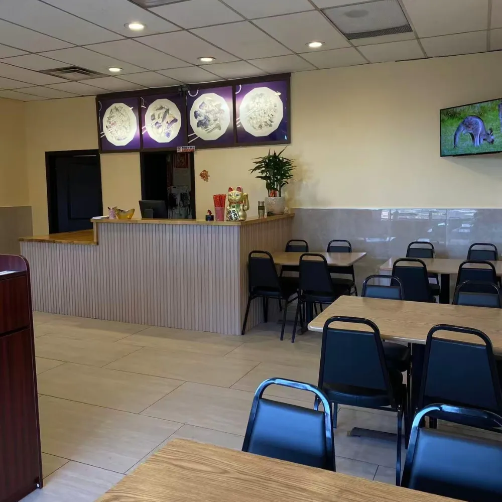 Cozy dining area with tables, chairs and wall decor at Oriental Chinese Restaurant, a Chinese Restaurant in Woburn